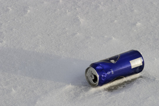 beer can on snowy ground.