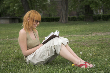 woman sitting and reading a book