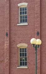 old brick building with lamppost