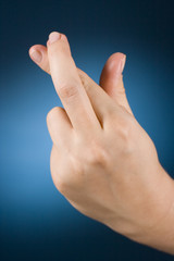 Fototapeta premium hand with crossed fingers
