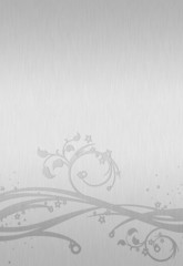 silver ornament on brushed silver plate