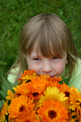 girl smelling a flowers