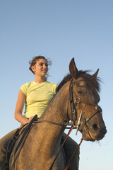 Fototapeta premium girl riding a horse
