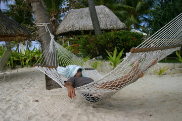 man resting on hammock