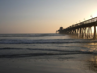 sun setting on the pier