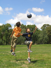 two boys playing soccer