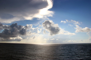 Naklejka na ściany i meble dramatic cloud formation over the blue ocean