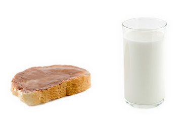 a piece of bread and glass of milk