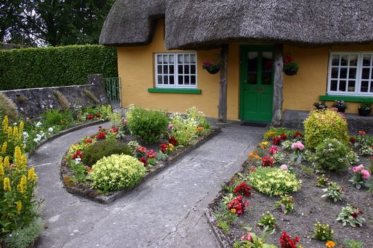 thatched roof cottage and garden