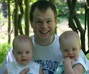 young father with twin girls