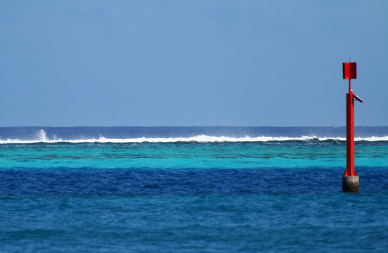 blue lagoon with a red sign