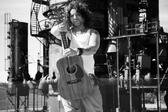 man holding guitar