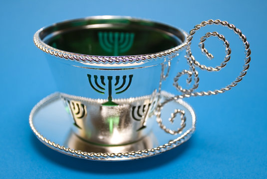 silver cup and saucer