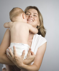 mother cuddling with her son