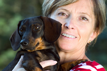 smiling woman and small dog