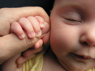 baby sleep with father's finger