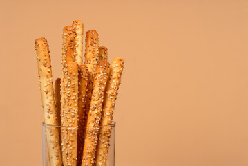 sesame breadsticks in clear glass