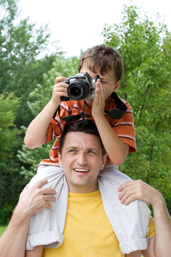 father and son taking a picture
