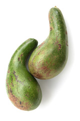 two green  avocadoes