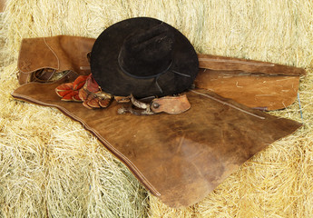 hat, gloves and spurs