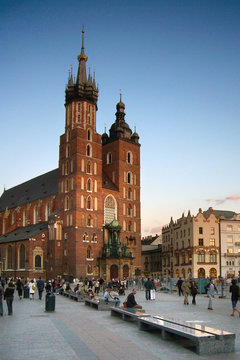 people relaxing on square in krakow