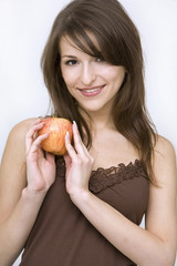 girl posing with red apple