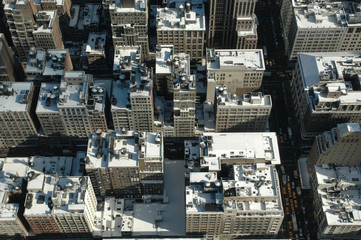Fototapeta premium snowy rooftops from above in new york city
