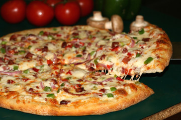 pizza with slice lifted