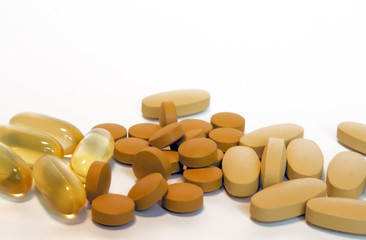 drugs. pills, or vitamins over white