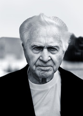 unhappy old man frowning