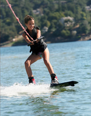 girl wakeboarding on the lake
