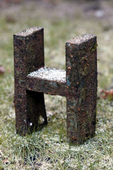 rusted letter h
