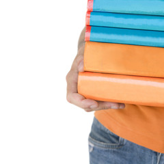hands holding a stack of books