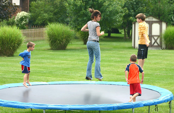 kids jumping on trampoline