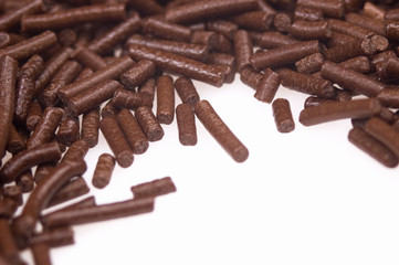 chocolate sprinkles on white background