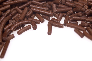 chocolate sprinkles on white background