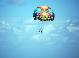 couple parasailing over miami beach