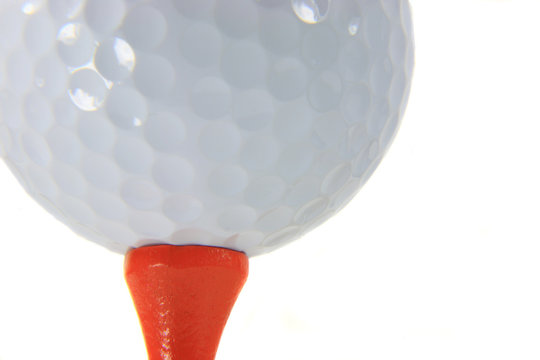 golf ball on orange tee