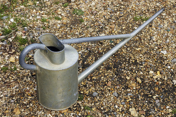 watering can on gravel