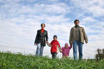 family of four on grass