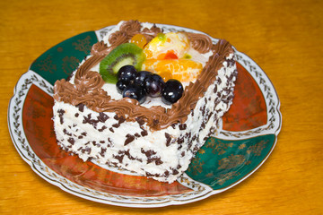 creamy cake with fruits and chocolate