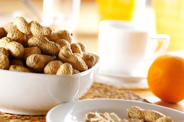 peanuts in white dish