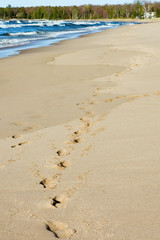 Fototapeta na wymiar footprints on beach, Lake Superior, Michigan, USA