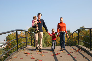 family of four on bridge