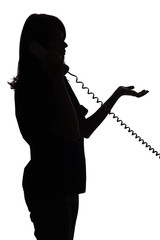 silhouette of woman on the phone