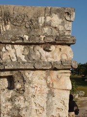 mayan stone carving in tulum, man in profile