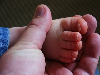 baby foot and thumb