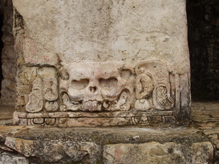 skull stone carving on mayan temple, palenque