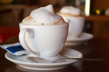 Papier Peint photo Lavable Chocolat two cappuccino cups with milk foam