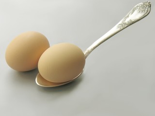 hens' eggs and a silver spoon